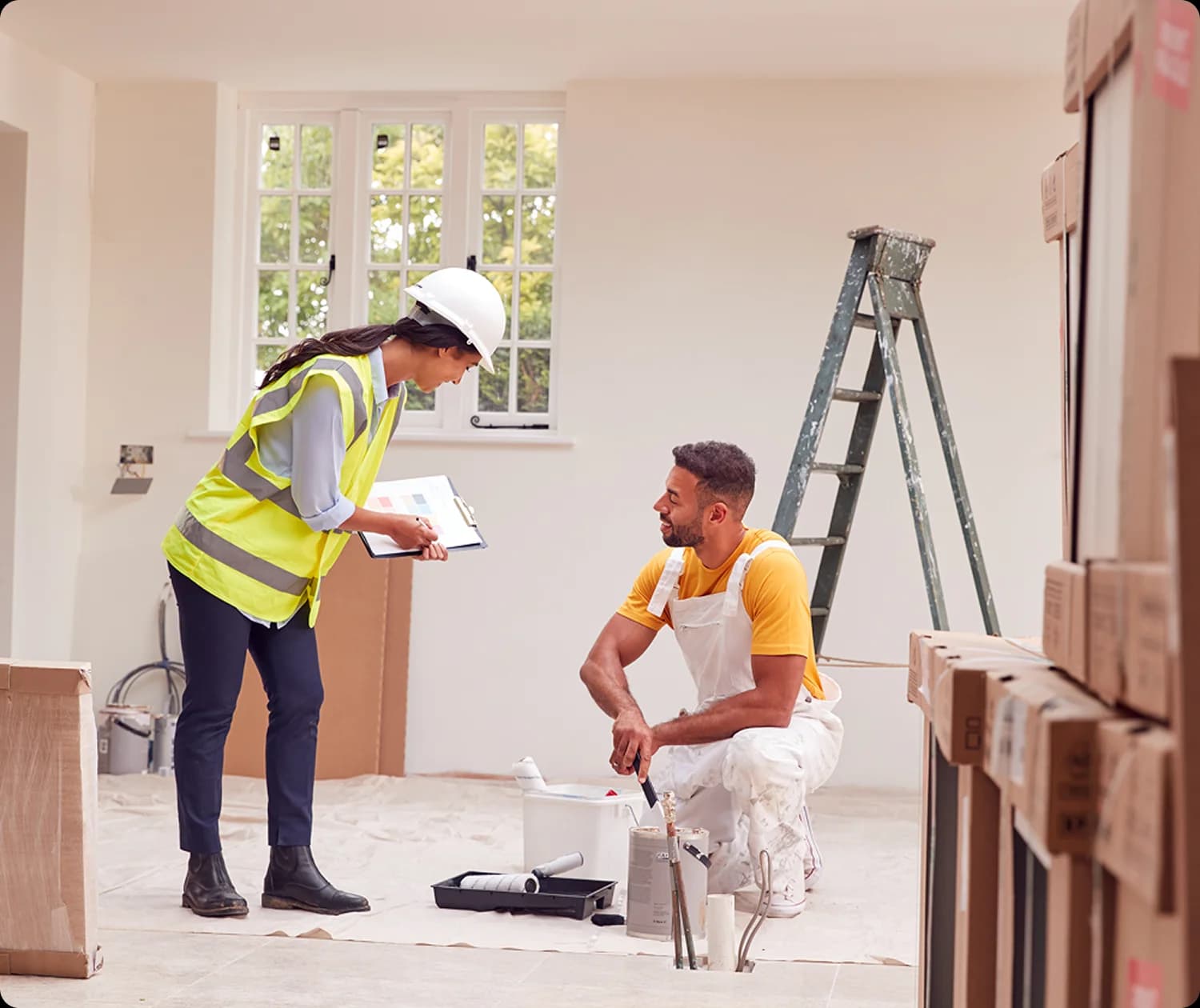 Renovation team reviewing a painting project