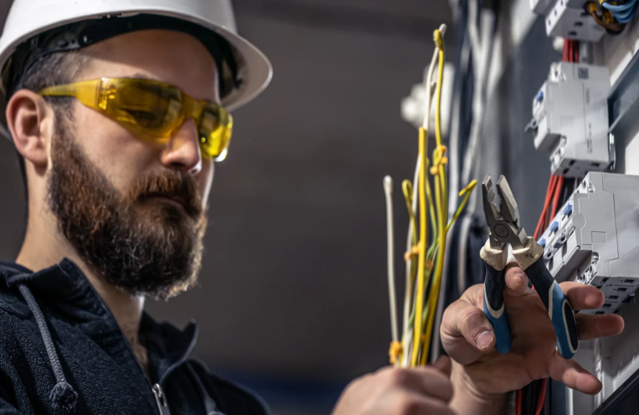 Electrician working on an electrical panel