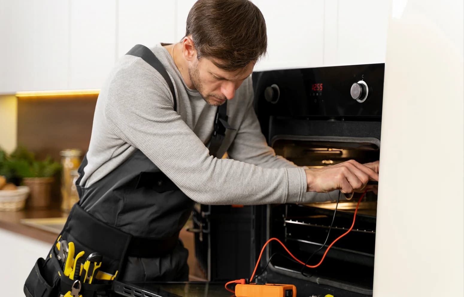 Technician repairing a home appliance