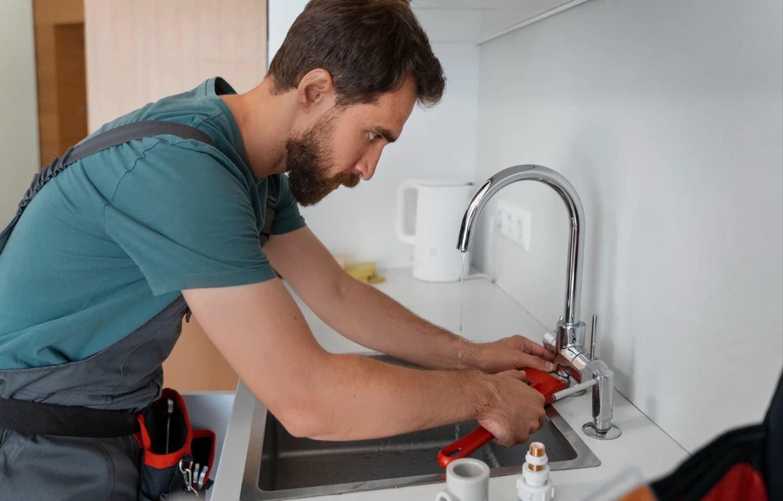 Plumber repairing home pipework